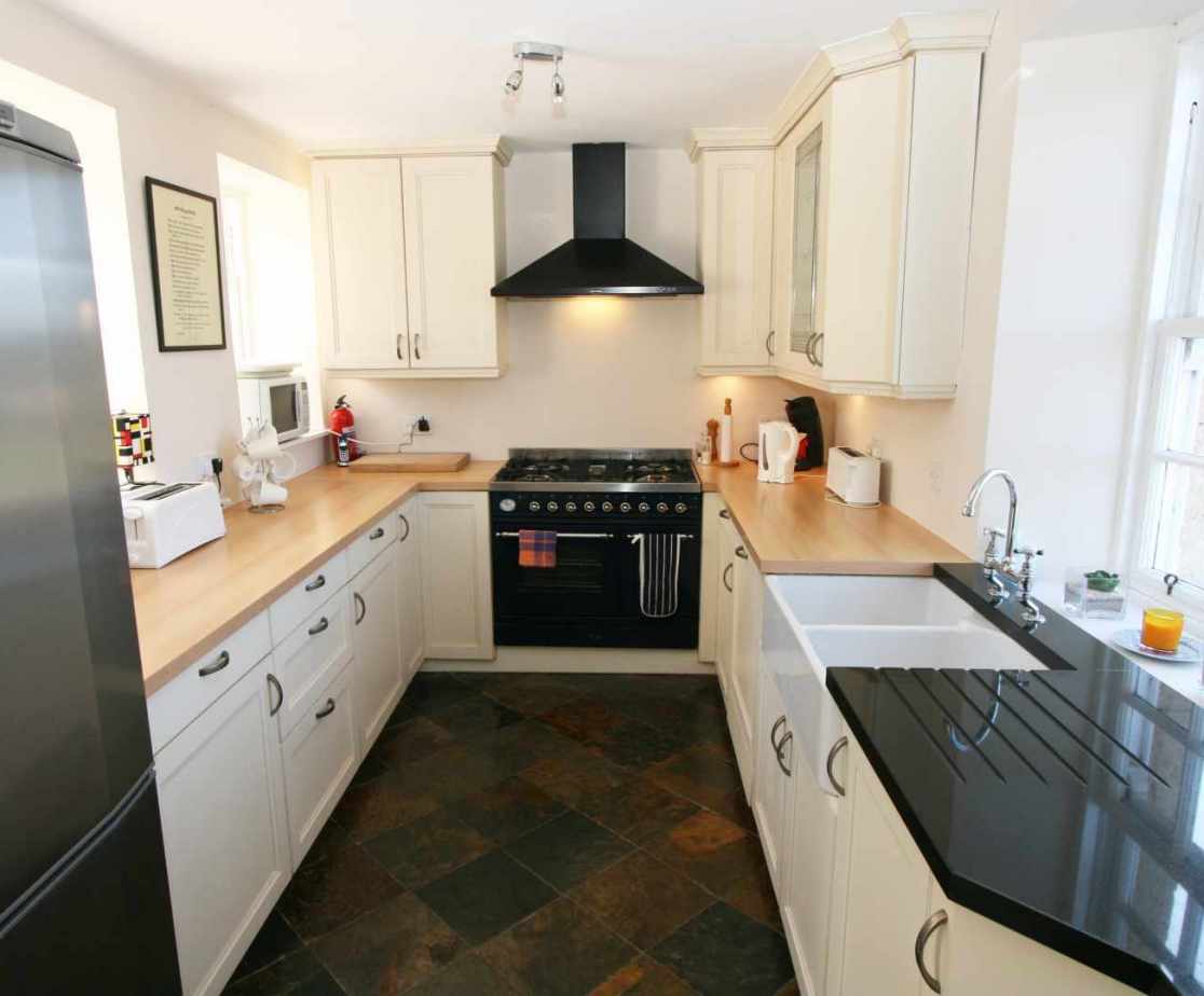 The kitchen is compact, modern and well designed with an impressive range cooker