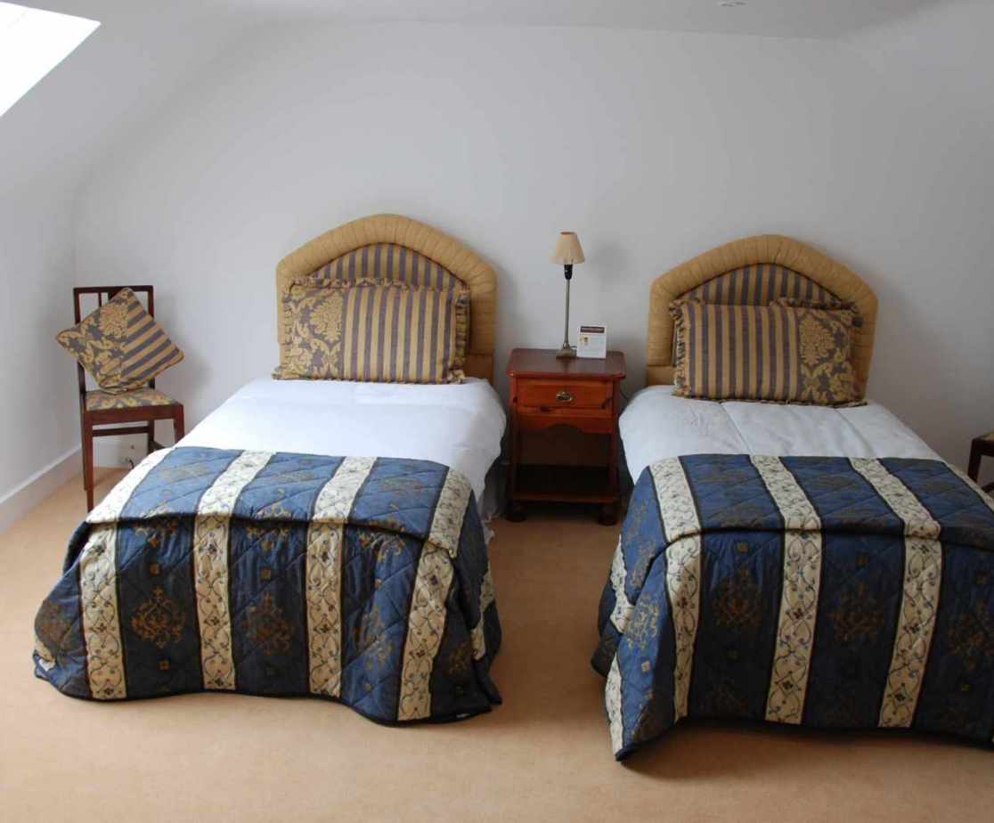 \'Attic 1\' bedroom. The top floor bedrooms have zip-n-link beds and can be twin or double