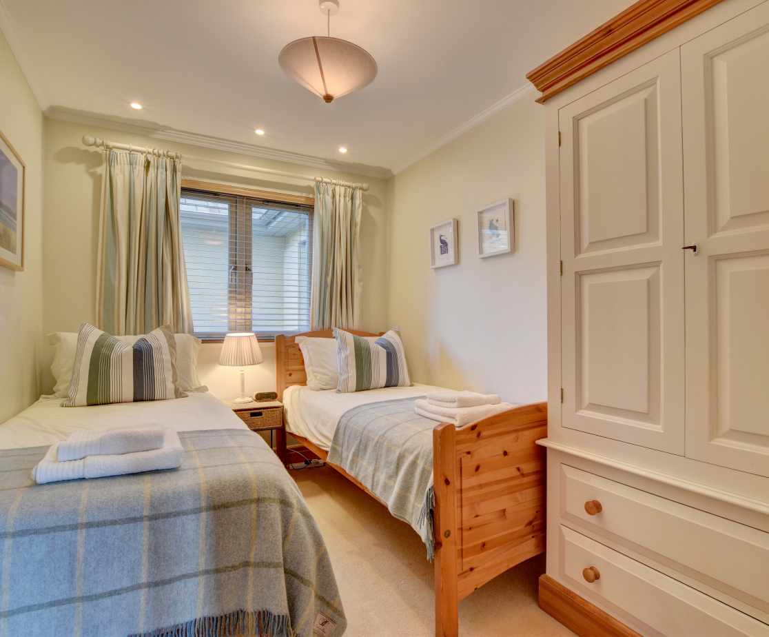 The fifth bedroom, a compact twin or spacious single by request, is on the ground floor