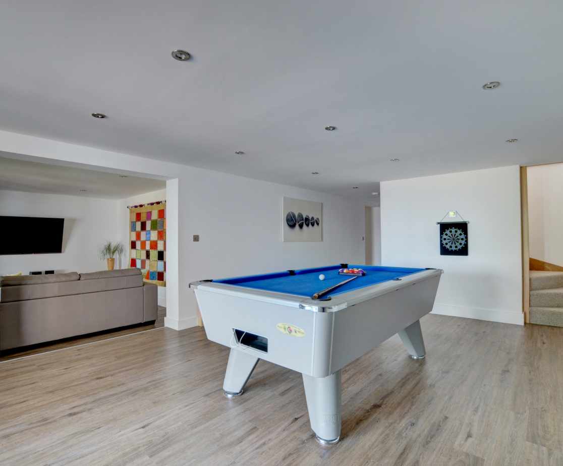 The pool room with second sitting room, ideal for the children