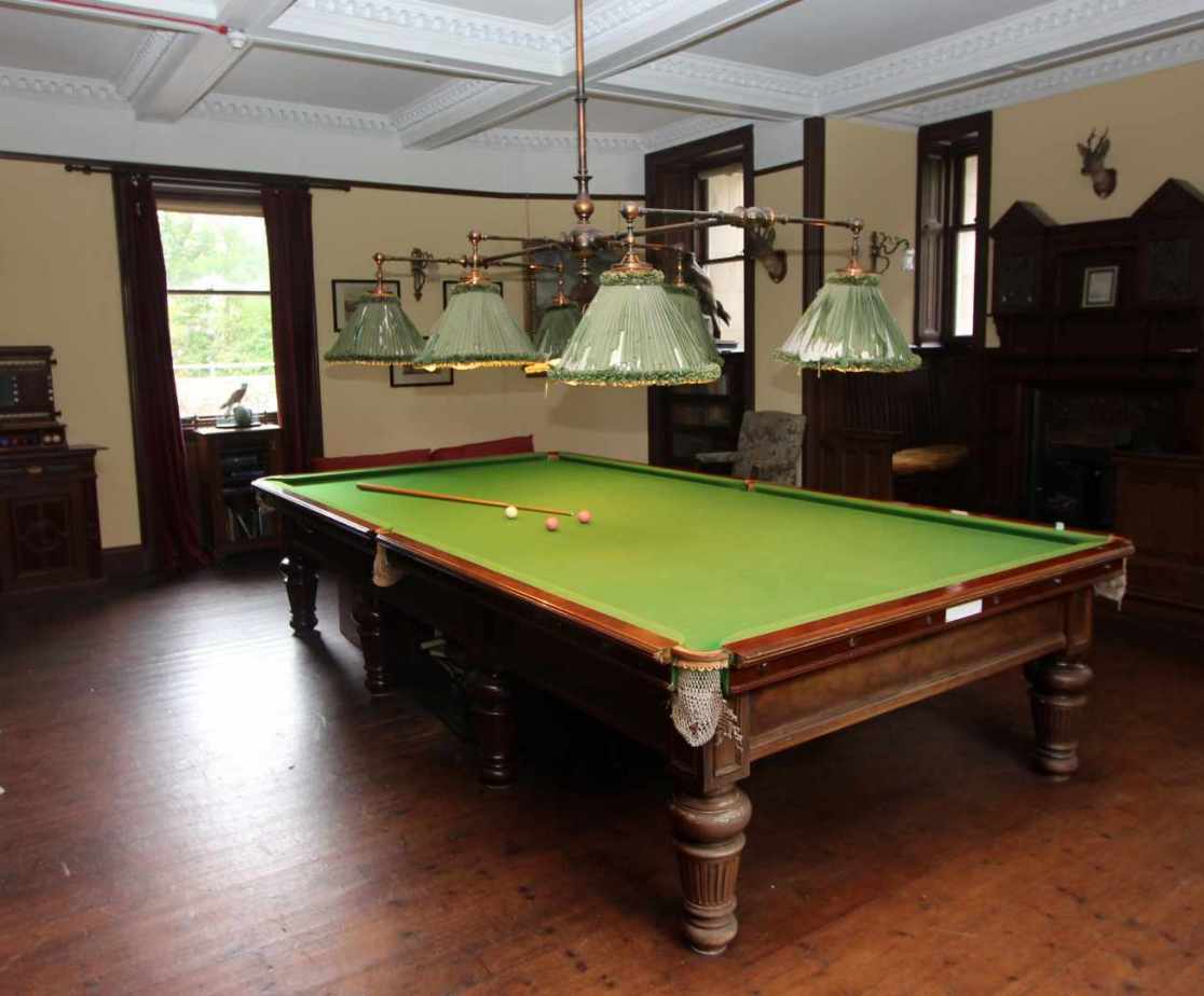 A snooker table is located in the basement
