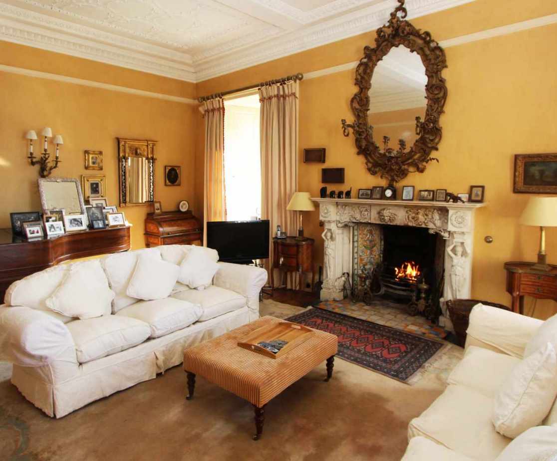 Enjoy the warmth of the fire in the elegant drawing room