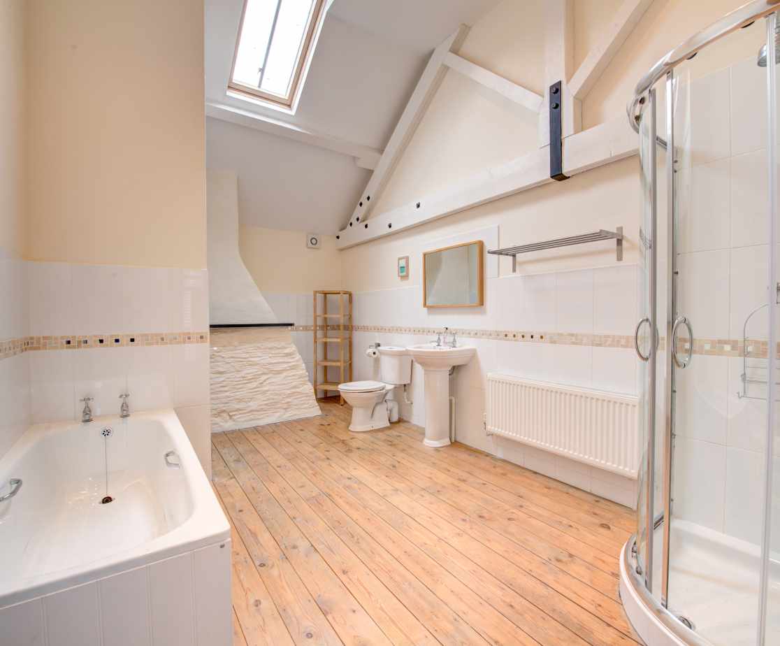 The bathroom is very generously apportioned with both a bath and separate corner powerful shower