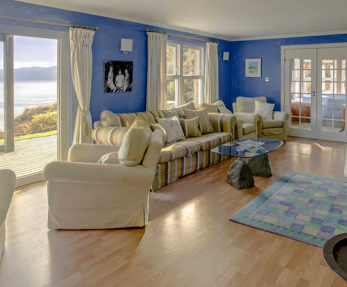 The large sitting room that opens onto the extensive deck overlooking the Loch