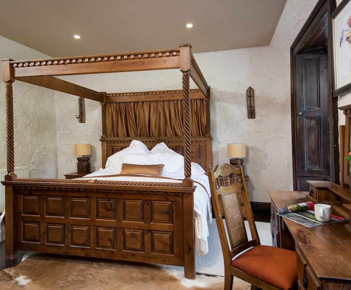 The \'Golden Eagle\' bedroom has a Four poster king size bed